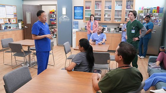 Nico Santos as Rene, Allison Tolman as Alex, and Mekki Leeper as Matt alongside other staff in 'St. Denis Medical' S2E8