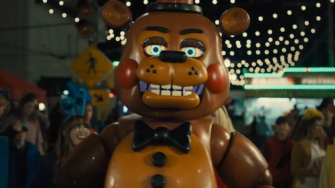Kellen Goff as Toy Freddy walking in a crowd in Five Nights at Freddy's 2
