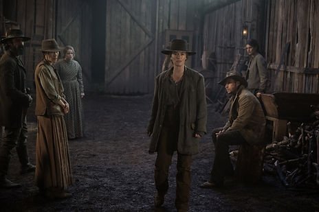 Clayton Cardenas as Quentin Serra, Elle-Máijá Tailfeathers as Oma Serra, Katelyn Wells as Samara Alderton, Lena Headey as Fiona Nolan, Nick Robinson as Elias Teller, and Diana Silvers as Dahlia Teller outside in an outdoors scene in 'The Abandons'. 