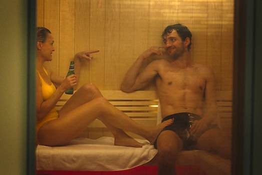 Robin Wright as Laura Sanderson and Laurie Davidson as Daniel Sanderson in a sauna in 'The Girlfriend'.