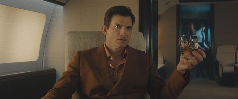 Ashton Kutcher as Byron Forst sitting in a private jet in 'The Beauty'