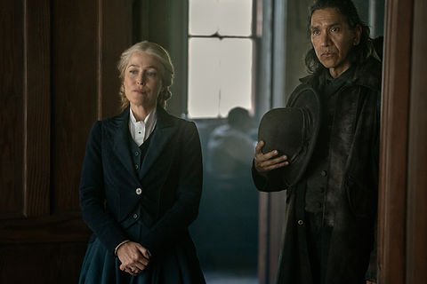 Gillian Anderson as Constance Van Ness and Michael Greyeyes as Jack Cree stand in a doorway in 'The Abandons.'