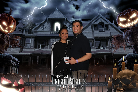 The author (right) in front of the Winchester Mystery House, with Jack-O-Lanterns along the borders and lightning in the background.