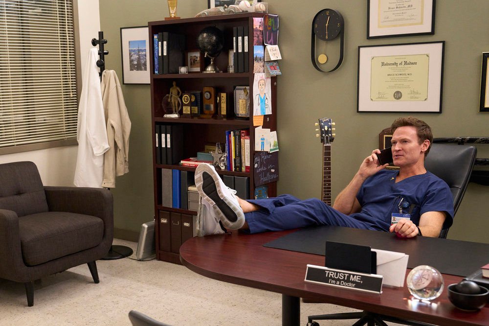 Josh Lawson as Bruce in St. Denis Medical