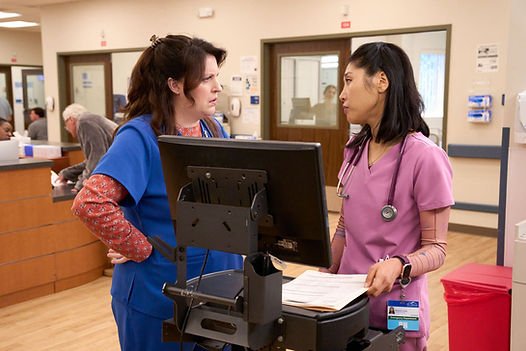 Allison Tolman as Alex and Kahyun Kim as Serena in St. Denis Medical