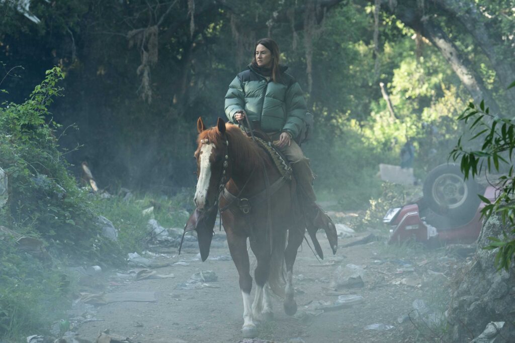 Shailene Woodley as Annie rides a horse through the woods in Paradise season 2.
