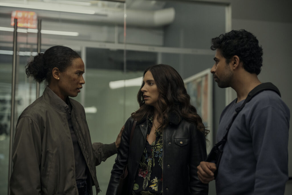 Fola Evans-Akingbola as Chelsea Arrington, Genesis Rodriguez as Isabel, Suraj Sharma as Jay Batra in episode 310 of The Night Agent. Cr. Christopher Saunders/Netflix