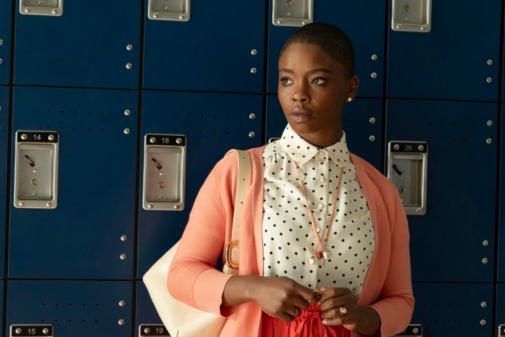 Joy Sunday as Jodie Plumb standing in front of a set of lockers in DTF St. Louis.